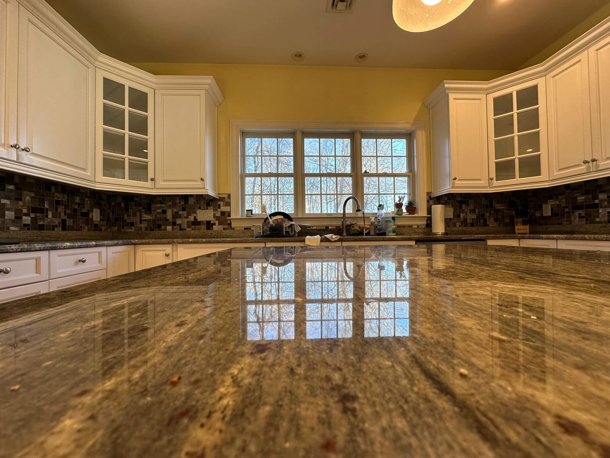 Freshly refinished kitchen cabinets by Cabinet Painters in Warwick, NY showcasing smooth white finishes and detailed craftsmanship.