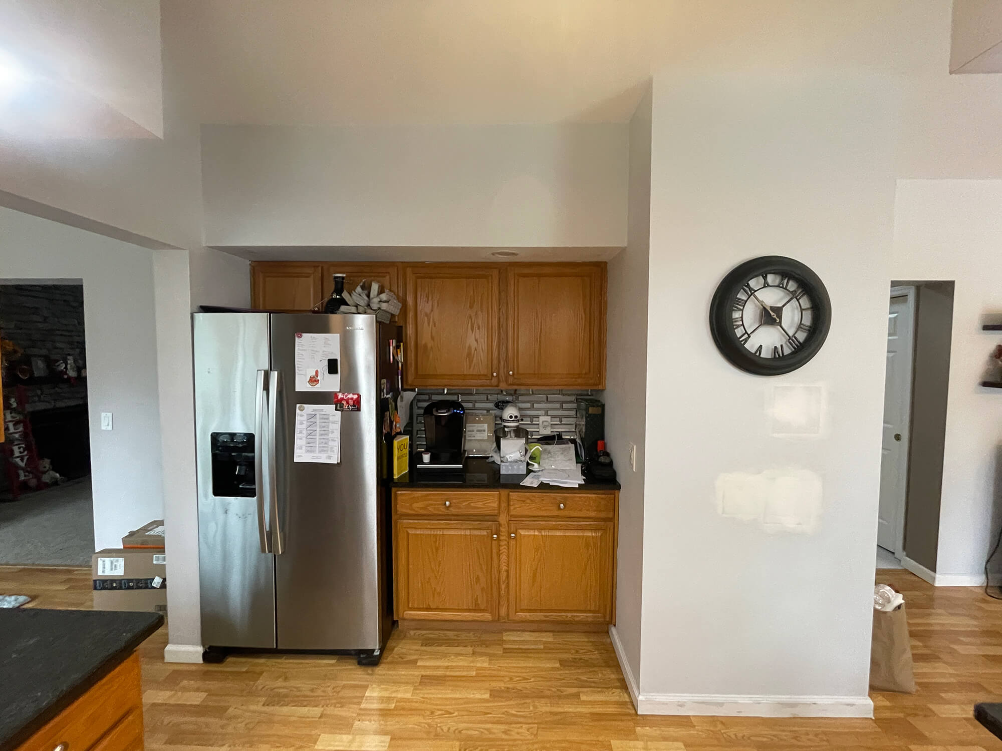 Kitchen wall preparation and cabinet area being prepped by professional painters in Tuxedo Park, NY