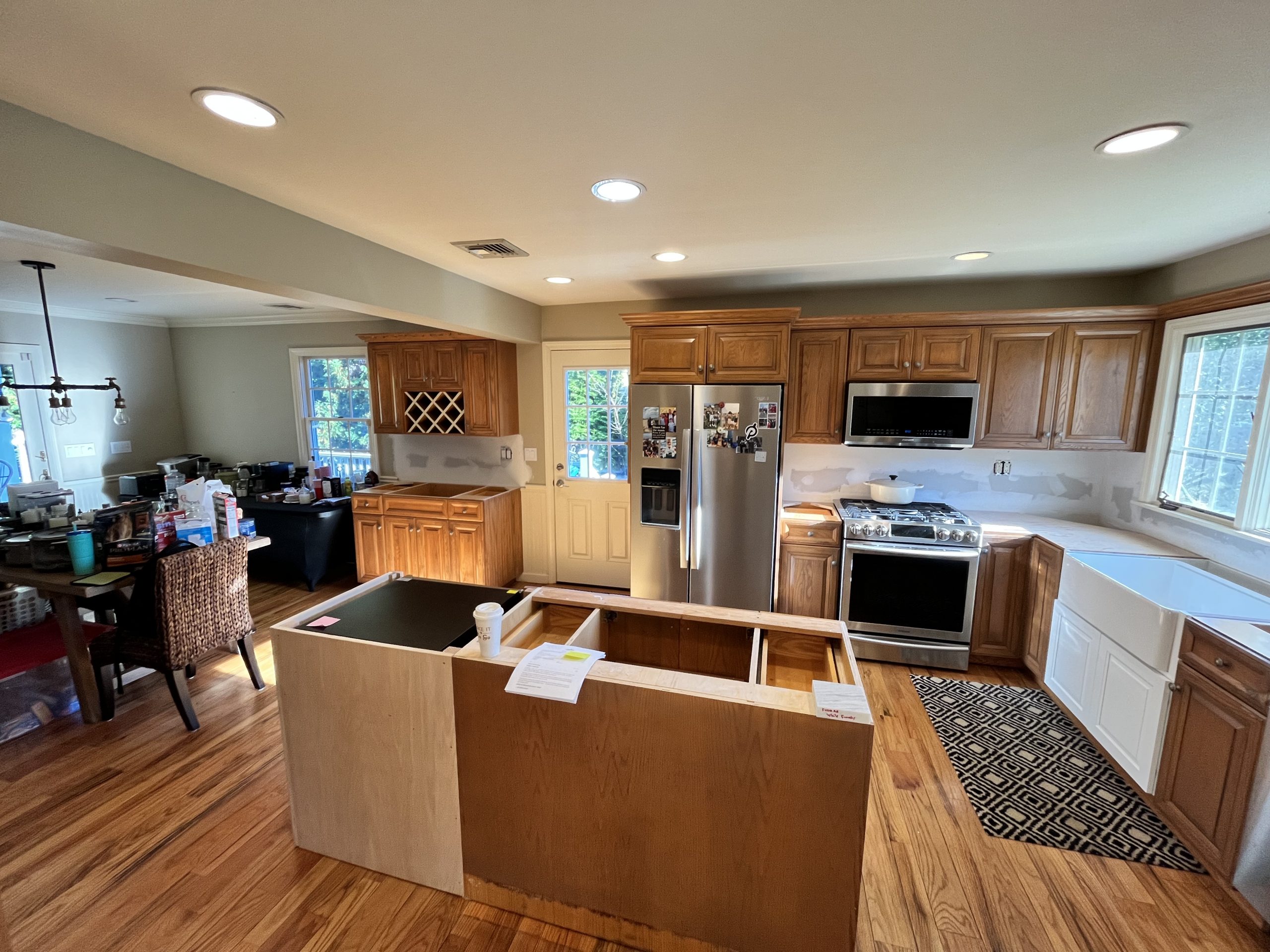 Before Kitchen Cabinet Refinishing Transformation New York New Jersey showing existing oak cabinets and raw island awaiting a high-end paint finish.
